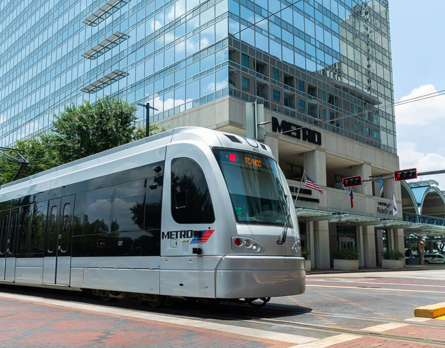 1900 Main St. METRO administrative building with Red Line train going by.