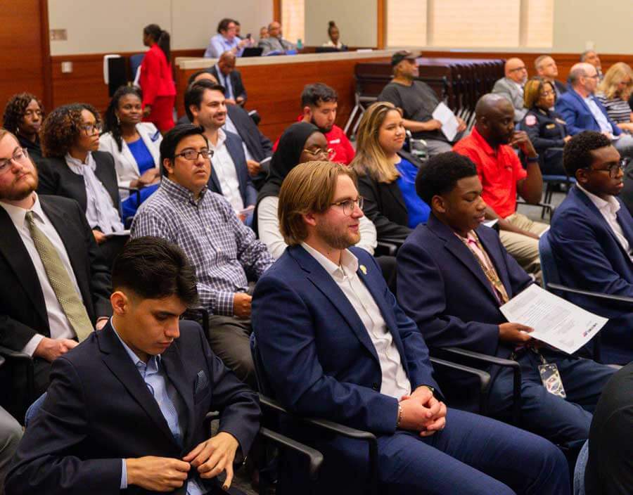 People sitting in the boardroom during a board meeting.