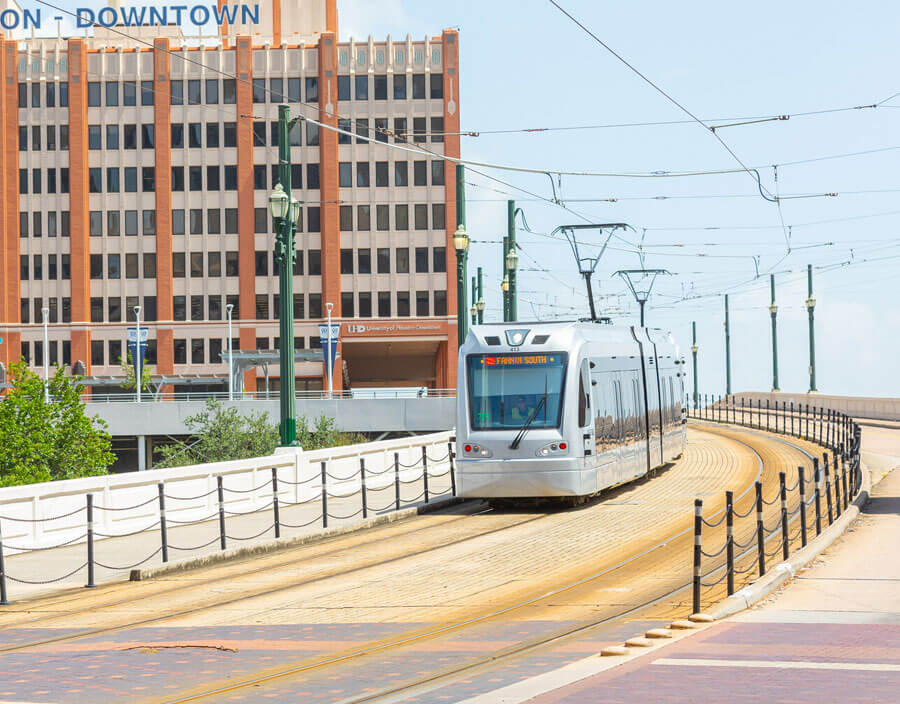 METRORail Red Line heading down bridge from UH Downtown.