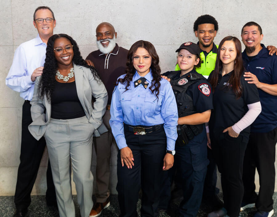 A diverse group of METRO employees smiling.