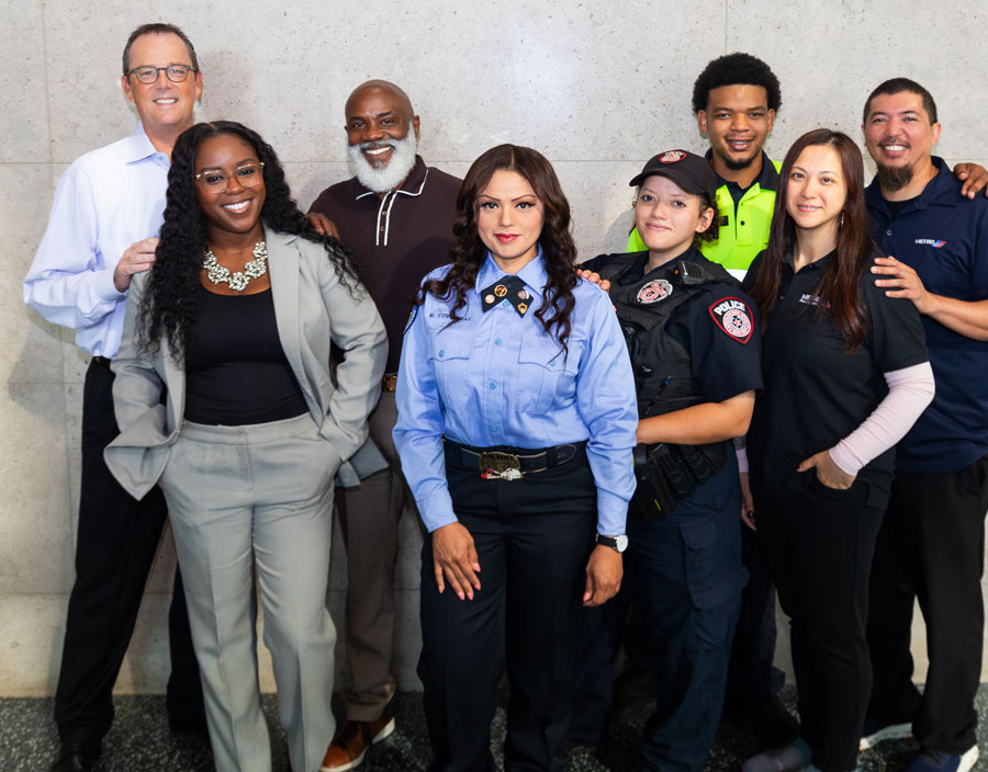 A diverse group of METRO employees smiling.