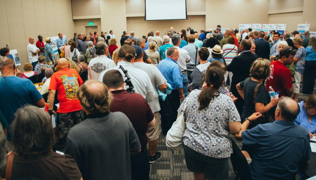 Photo shot from the back of a room filled with community members at METRONext meeting.