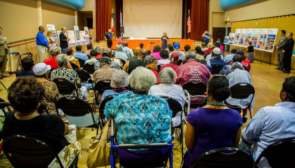 Photo shot from the back of a room filled with community members at METRONext meeting.