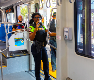 13447-MPD-Officer-Onboard-METRORail METRO Police Officer patrolling on METRORail.