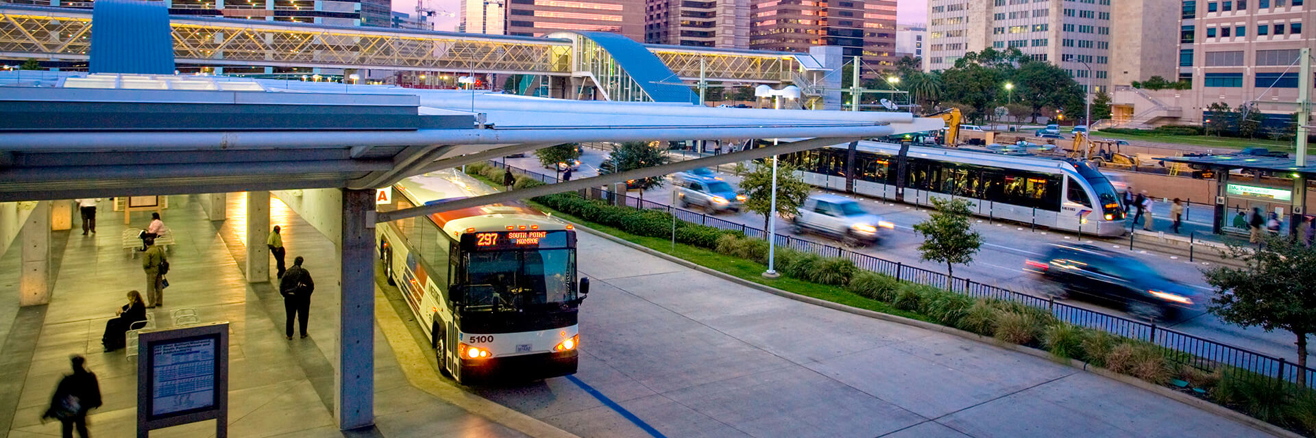 METRO Park & Ride bus and METRORail Red Line traveling through the Texas Medical Center Transit Center.