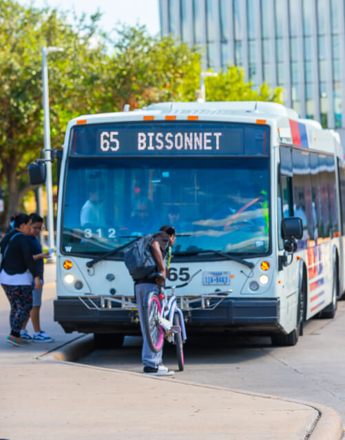 17111-Bike-and-Ride Bike being loaded on the front of a local bus.