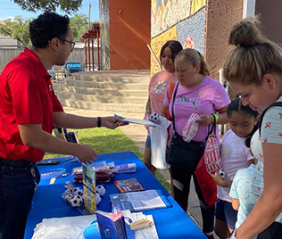 METRO-Public-Engagement METRO public engagement employee speaking with members of the community.