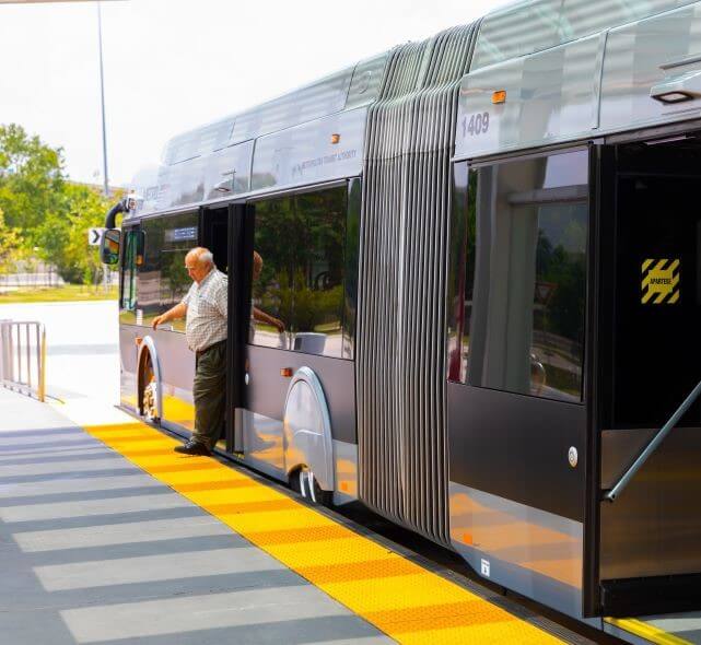 Man exiting the METRORapid Silver Line.
