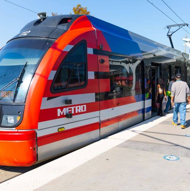 Customers boarding METRORail Red Line Train headed towards Fannin South Transit Center.