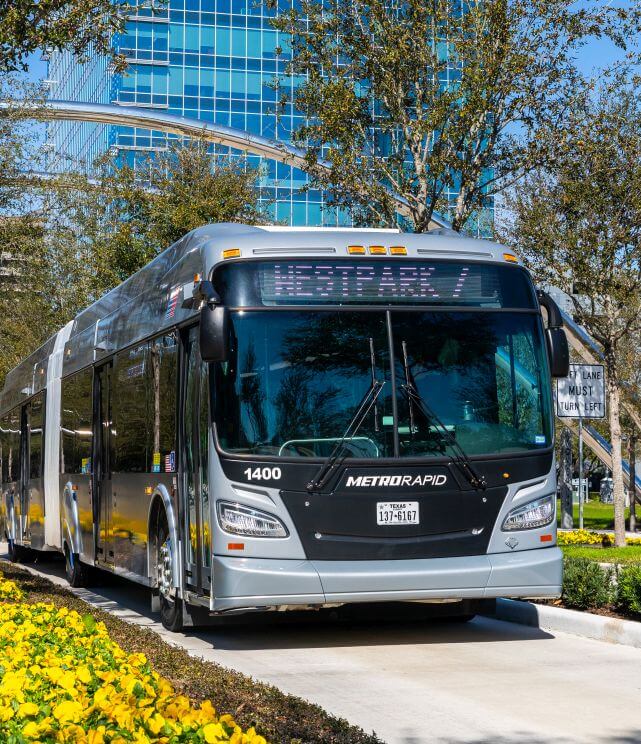 METRORapid Silver Line vehicle traveling south in dedicated lane along Post Oak Blvd. in Uptown Houston.