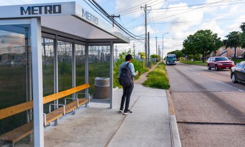 METRO bus shelter with a waiting customer.