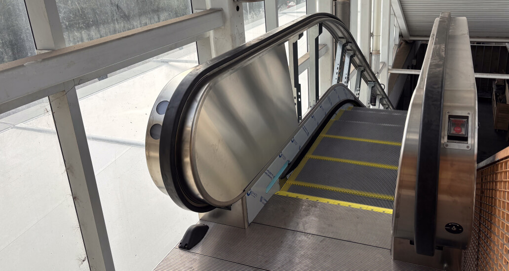 An escalator located inside the TMC Transit Center allowing access to the pedestrian skybridge.