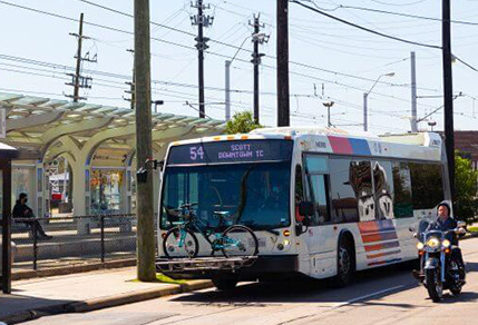 A local bus traveling along the 54 Scott route.