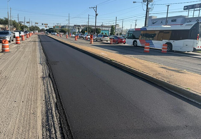 METRO bus traveling near Hillcroft Avenue street repairs.