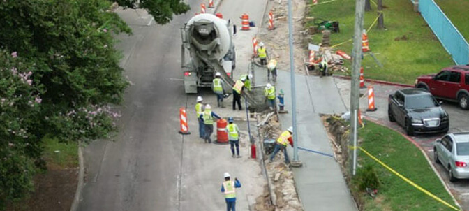 Construction crews pouring concrete sidewalks along imperial valley drive