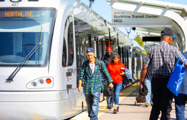 METRORail Red Line stopped at the Northline Transit Center / HCC platform.