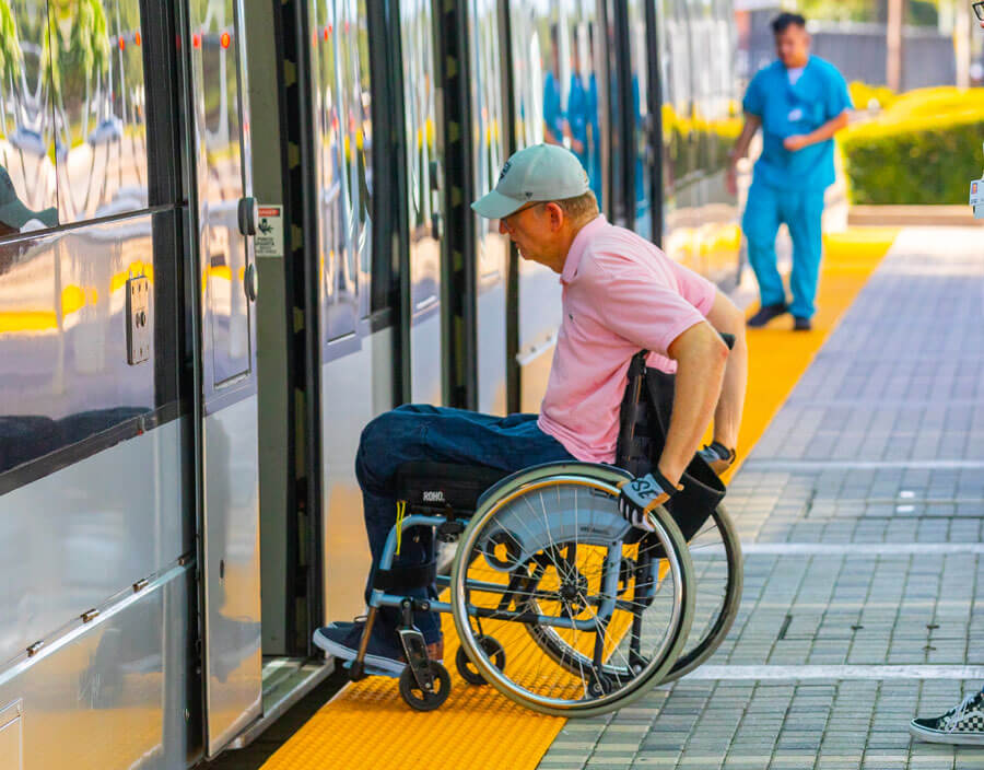 METRO rider on wheelchair boarding train.