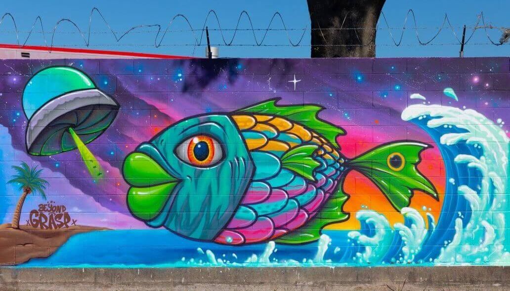 Mural of a fish along the outer wall of the Kashmere bus operating facility at 5700 Eastex Freeway in Houston