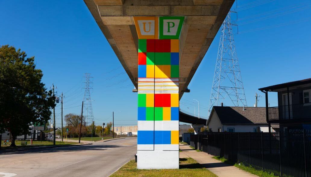 Multicolored mural on a vertical column under METRORail tracks near Roosevelt Elementary School at 6700 Fulton St. in Houston