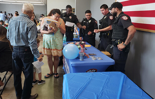 METRO Police Department Officers speak with local residents at a National Night Out program.