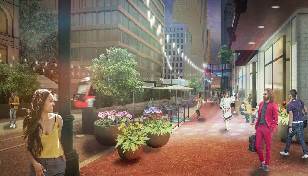 Urban design rendering of people walking along a pedestrian mall as a METRORail train passes along the street.