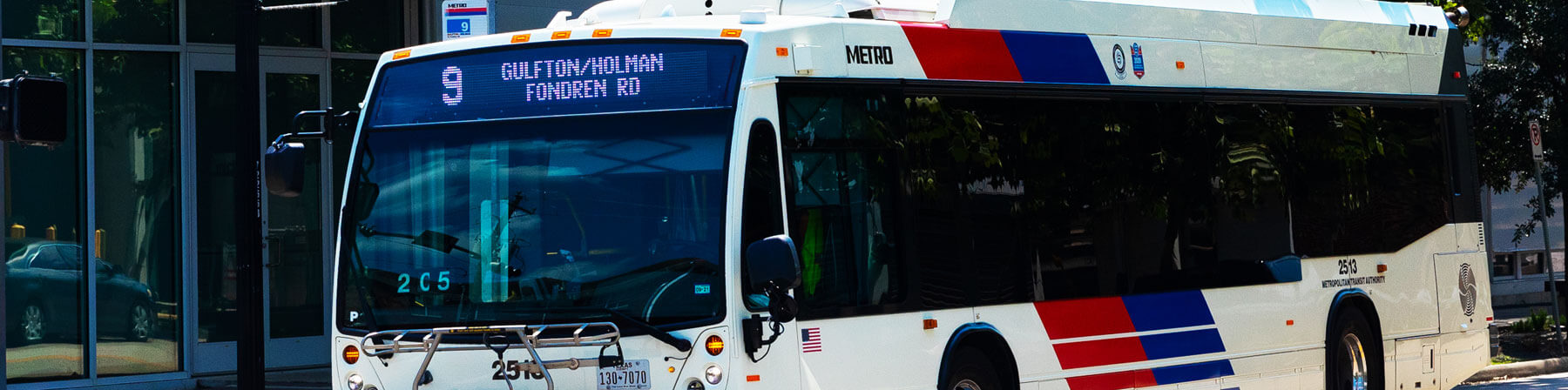 METRO bus route 9 Gulfton / Holman at a bus stop along that route.