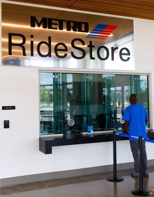 Customer being helped at Northwest Transit Center METRO RideStore at 7373 Old Katy Road in Houston.