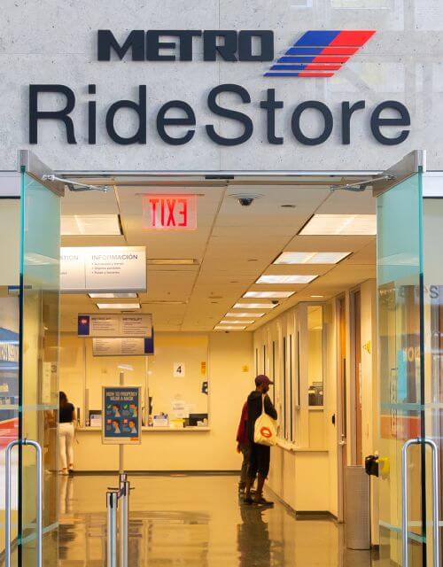 Customer being helped at Downtown Transit Center METRO RideStore at 1900 Main Street in Houston.