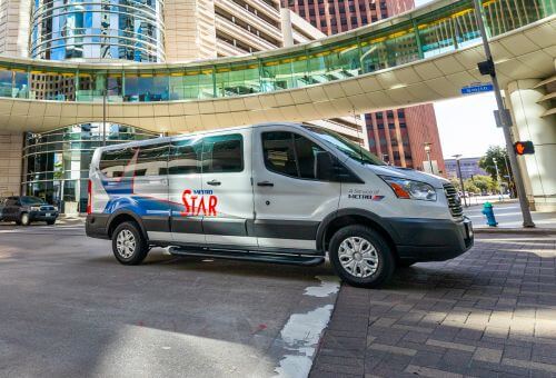 METRO STAR Vanpool van traveling through Downtown Houston