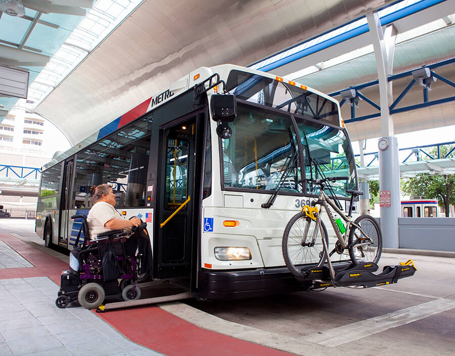 Customer in a wheelchair boarding METRO bus.