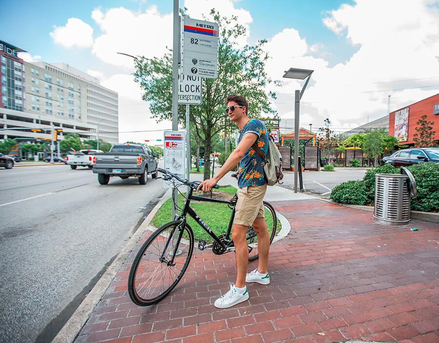 METRO customer waiting at bus stop for 82 Westheimer bus