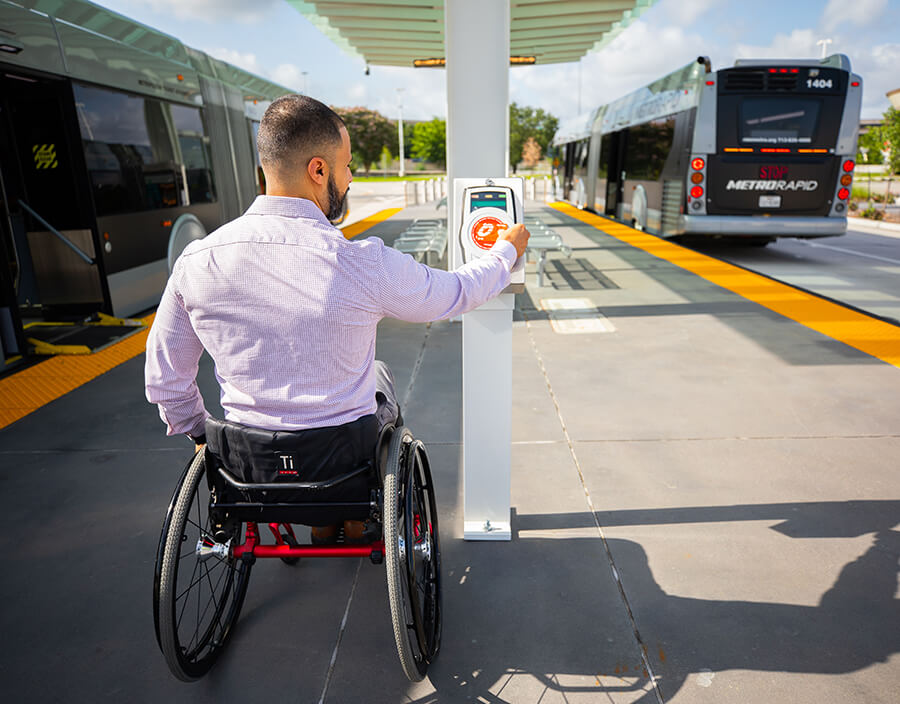 Passenger in a wheelchair boards METRORapid