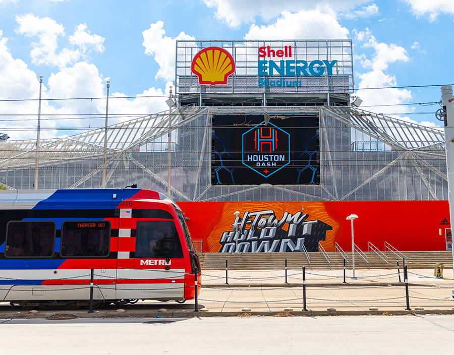 METRORail traveling by Shell Energy Stadium.