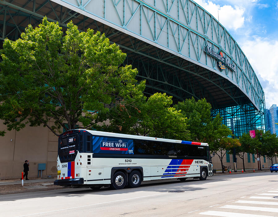 METRO local bus traveling downtown near Minute Maid Park.