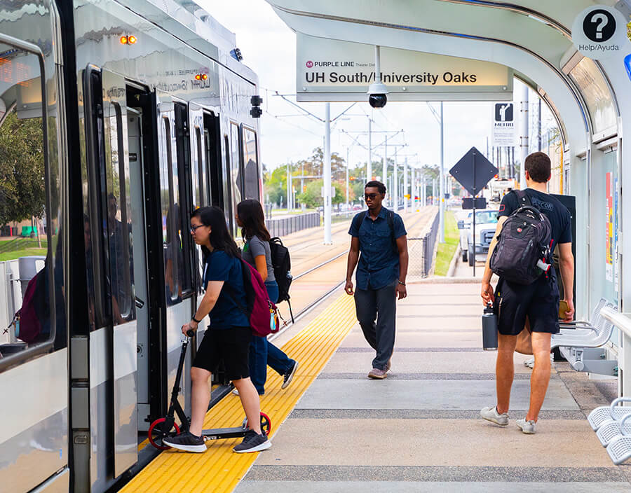 Students boarding the METRORail Purple Line.