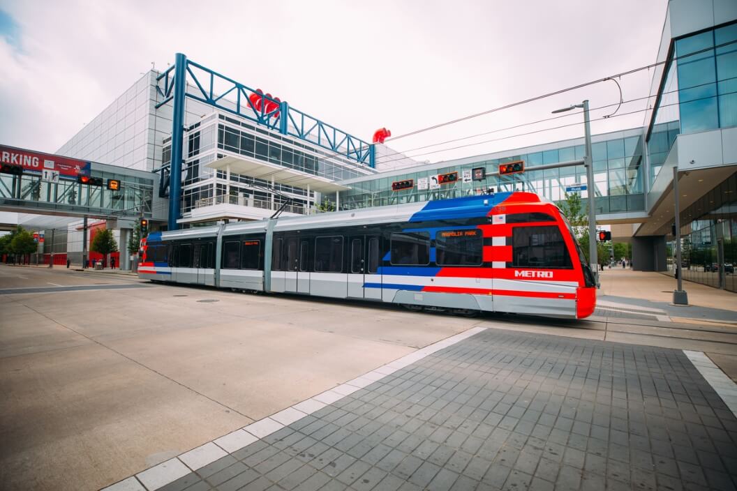 This color photo features METRORail passing by the George R. Brown Convention Center in downtown Houston