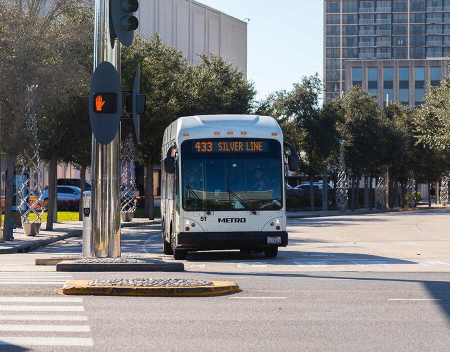 The METRORapid Silver Line traveling in a dedicated lane through Uptown Houston.