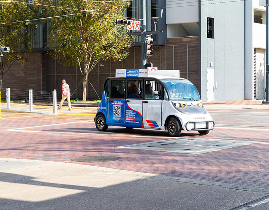 A Community Connector vehicle traveling near the Downtown Transit Center.