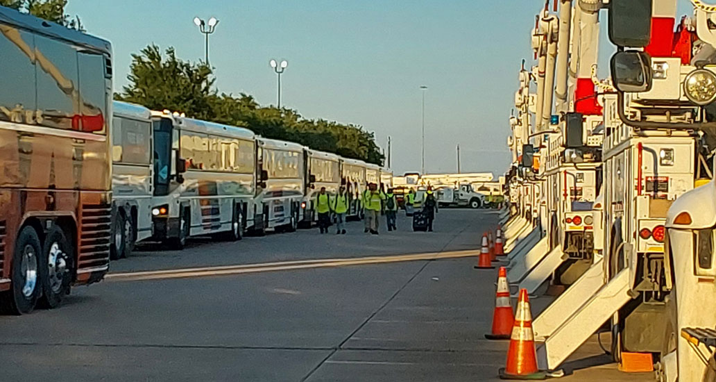 METRO buses and utility trucks lined up.