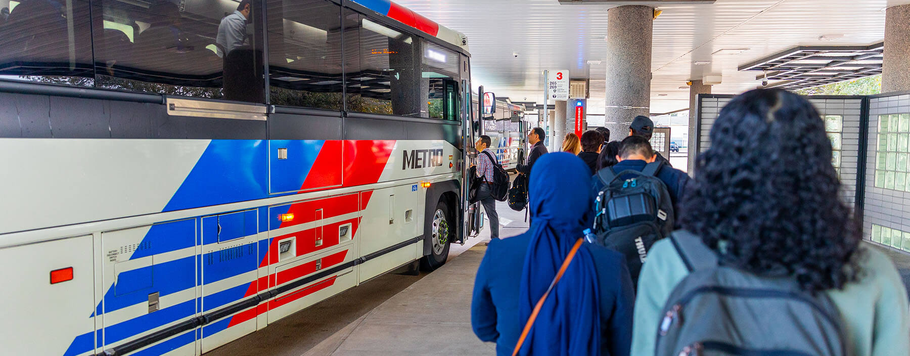 Riders in line boarding a Park & Ride bus.