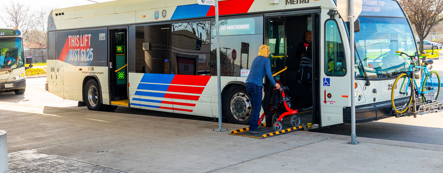 Rider with walker boarding a local METRO bus.