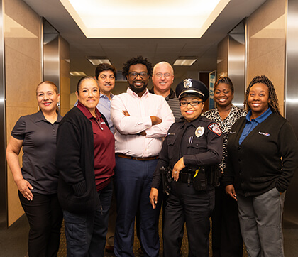 A diverse group of METRO employees smiling.
