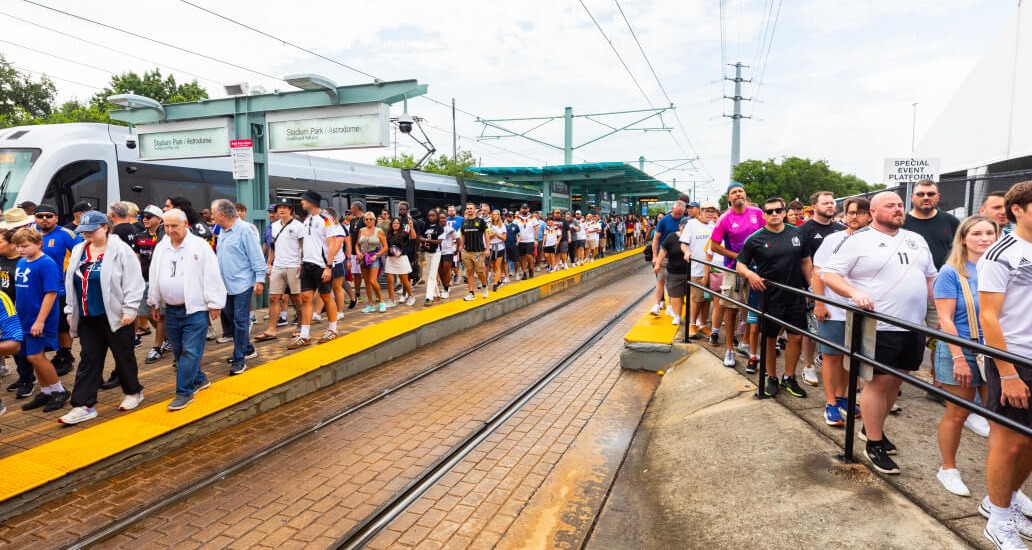 Crowd of METRO riders exiting rail at Stadium Park/Astrodome.