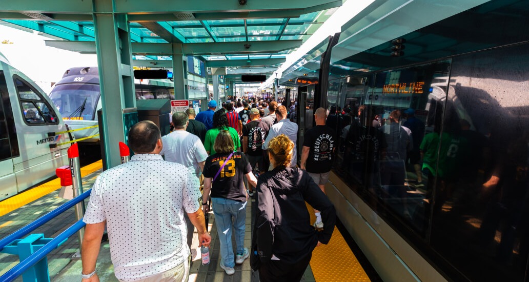 Crowd of METRO riders exiting the rail at Stadium Park/Astrodome.