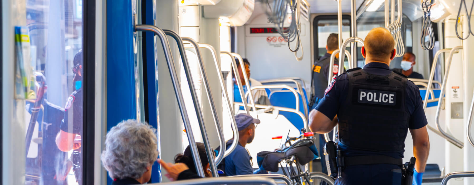 METRO police officer patrolling inside the train.