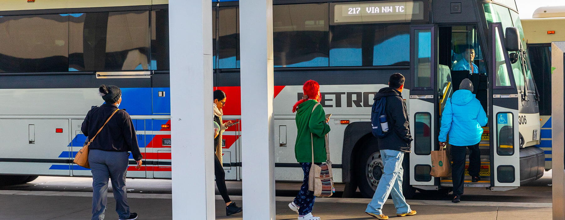 Customers boarding the 217 Park & Ride bus.