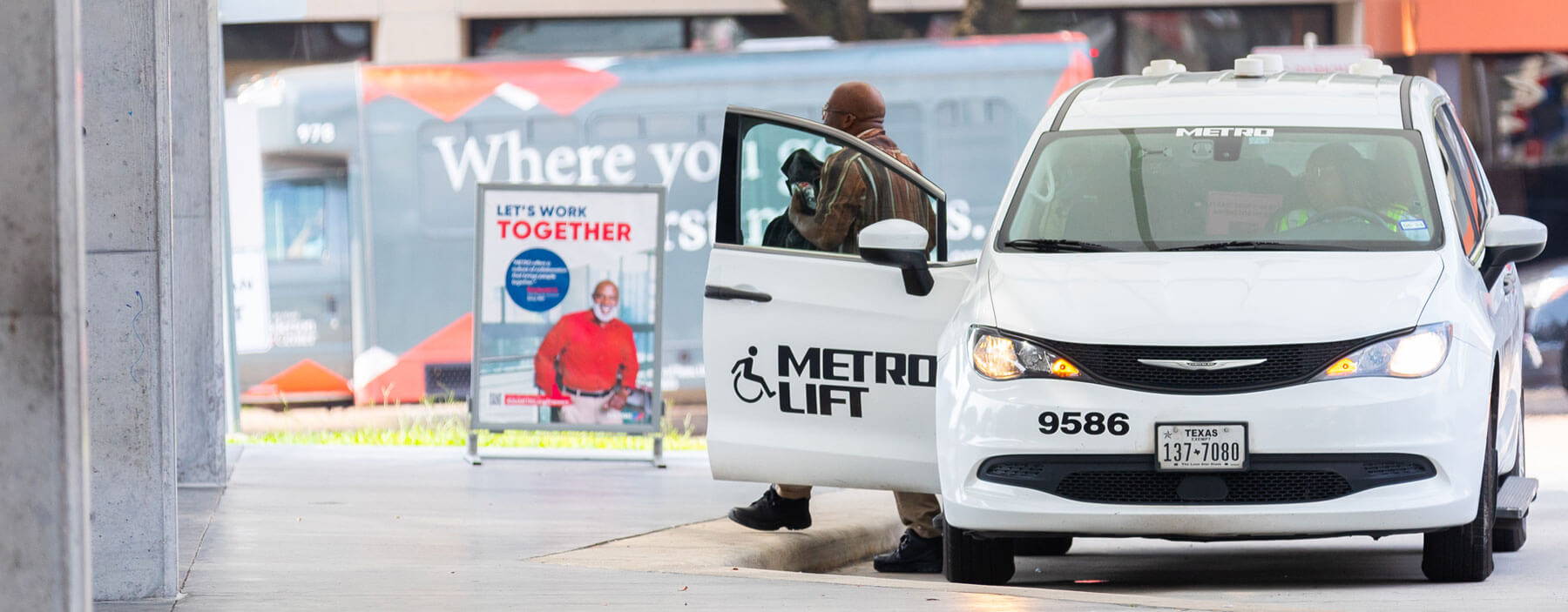 METROLift van rider getting off at at METRO Transit Center.