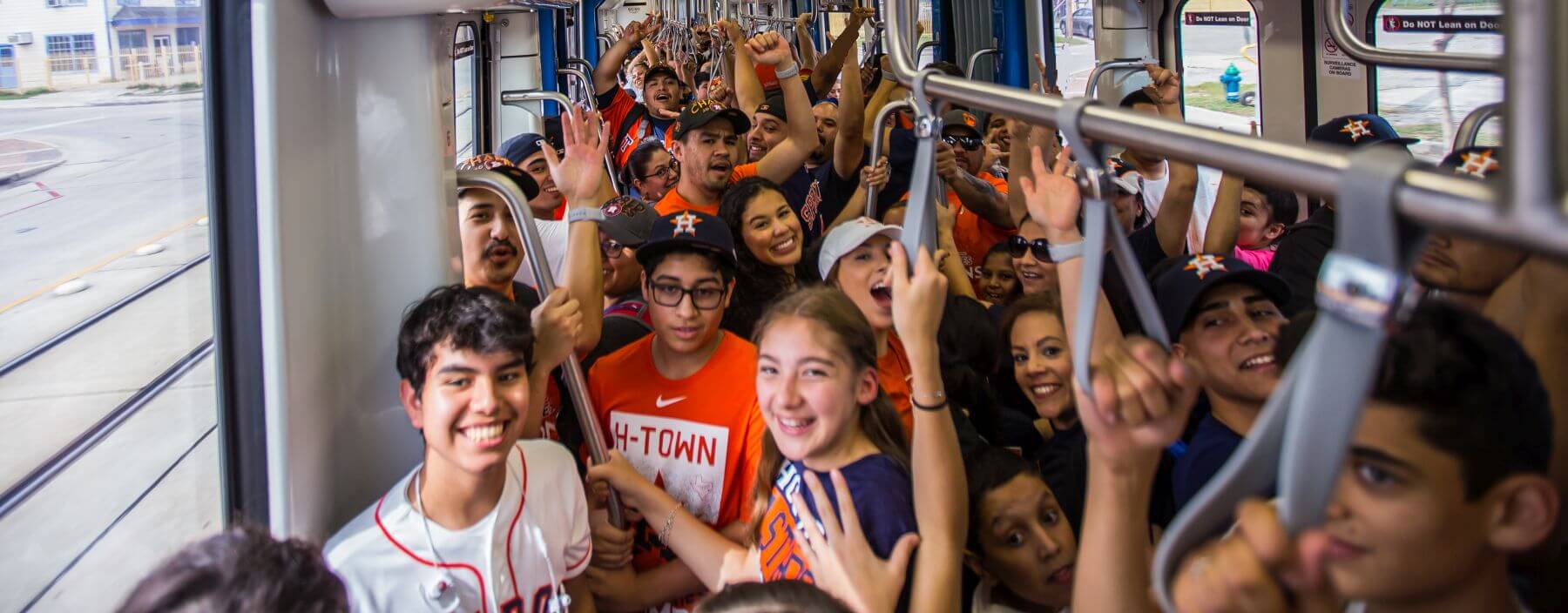 Astros fans inside METRORail train