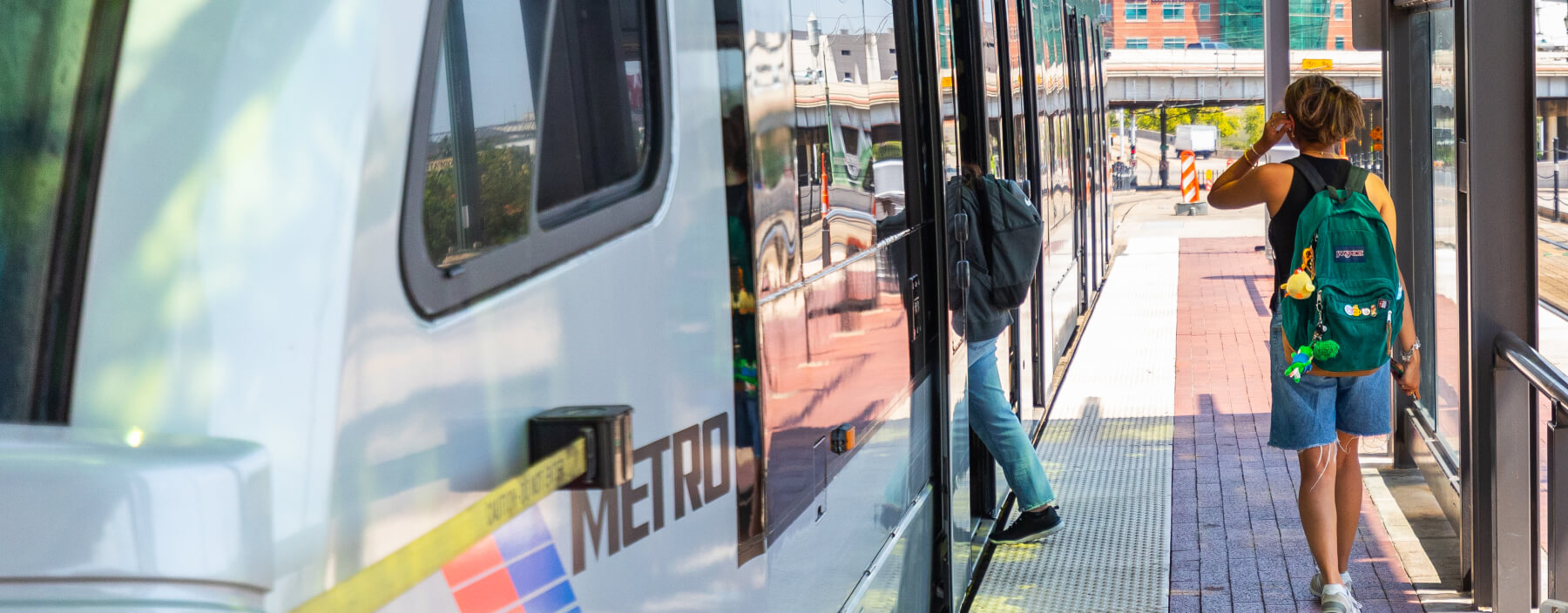 Student riders boarding a METRORail train