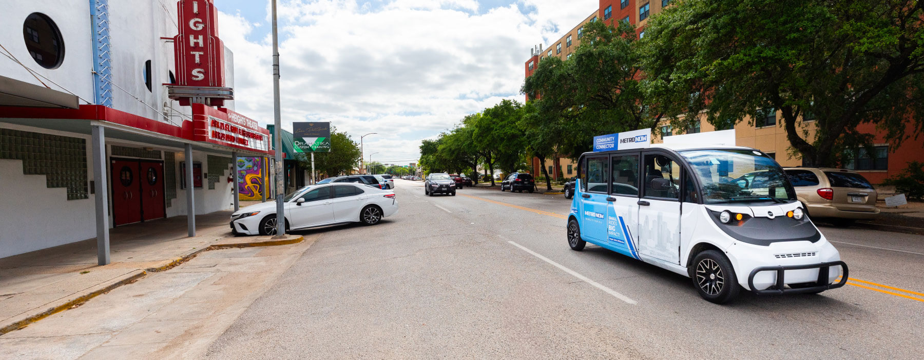 A Community Connector shuttle passing through The Heights neighborhood.